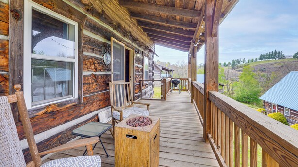 A wooden cabin with a porch, a grill, and a view of the surrounding landscape. - 2 Mi to Blue Ridge Pkwy! Mtn Escape w/ Fireplace (Meadows Of Dan)