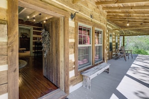 A log cabin with a porch, wooden floors, and a bench. - Trout Stream Access! Rural Buchanan Cabin (Buchanan)