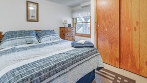 A bedroom with a bed, dresser, and wardrobe. - Sunset Side of Seneca Lake! Family Home w/ Dock (Hector)