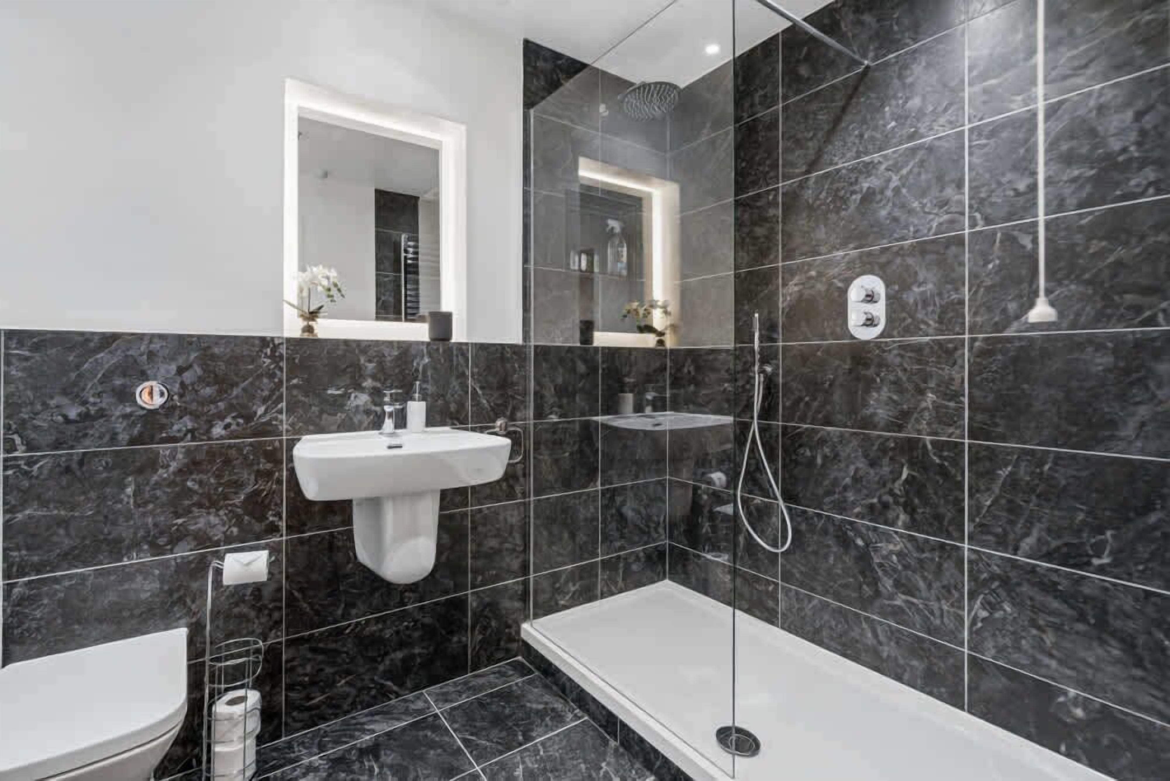 Shower, hair dryer, towels, shampoo