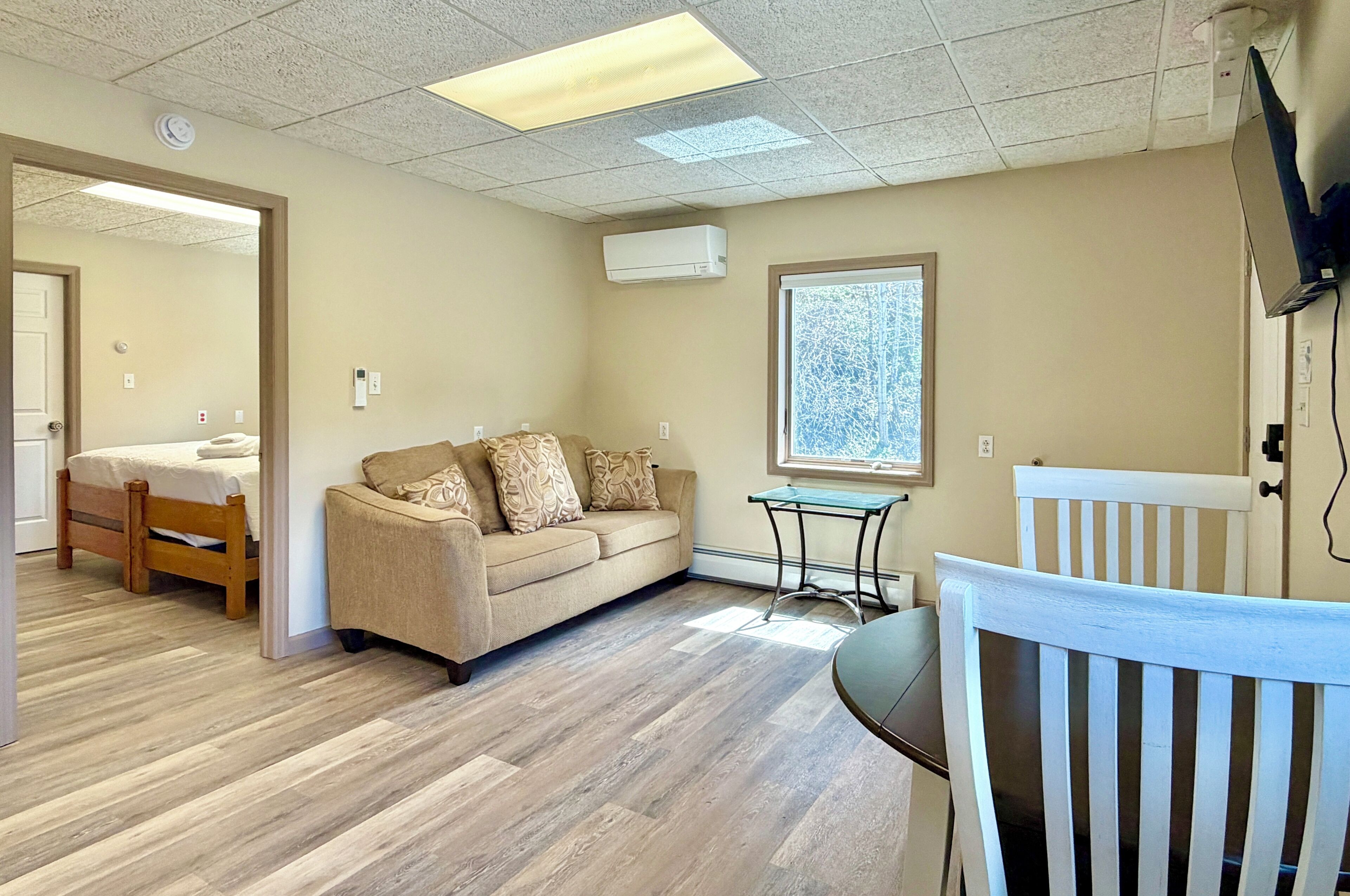 Cozy living area with natural light and comfortable seating