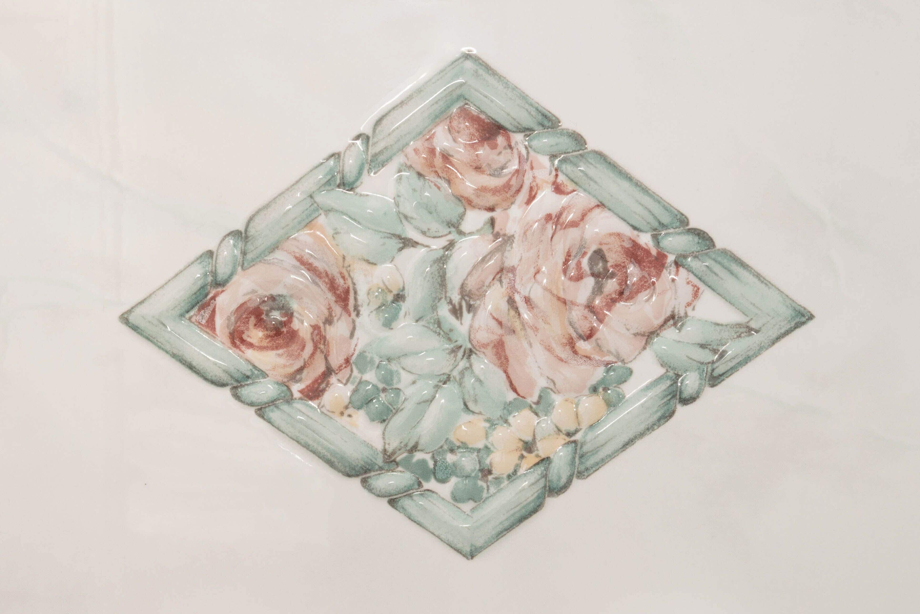 A square-shaped object with a floral pattern.