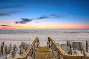 A wooden boardwalk leading to a beach with a clear sky. - ⭐BEACH FRONT-3 Gulf Front Balconies-3BR The Q⭐ (Miramar Beach)