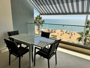 Outdoor dining - Modern Beachfront 2BR with Terrace, A/C, WiFi & Garage in top location (Quarteira)