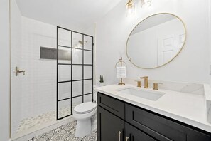 Shower, jetted tub, hair dryer, towels