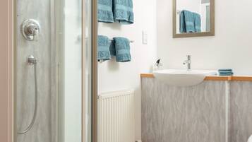 Shower, hair dryer, towels, soap