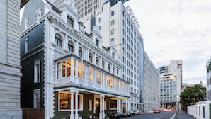 A historic building with a classic facade, large windows, and a corner entrance. - The Cape Town Club (Cape Town)