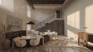A modern interior with a staircase, a dining area with chairs and a table, and a large plant. - Castilla Termal Palacio De Avellaneda (Penaranda de Duero)