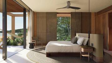 A bedroom with a bed, a ceiling fan, a nightstand, a chair, and a view of the outdoors.