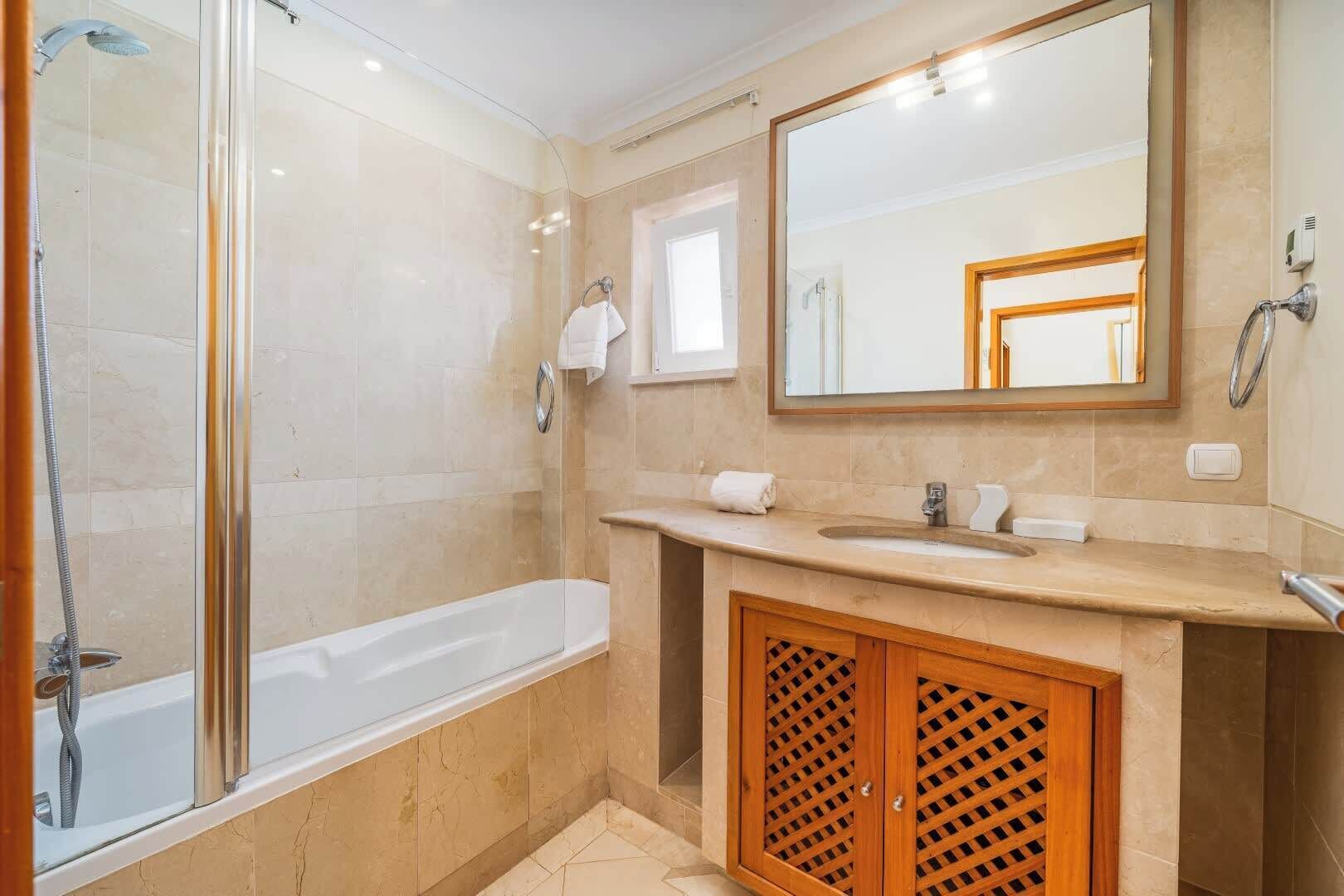 Shower, hair dryer, towels, shampoo
