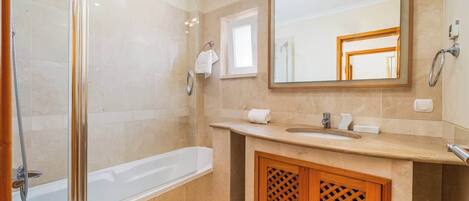 Shower, hair dryer, towels, shampoo