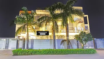 A modern building with a sign reading 'TOWNHOUSE.'