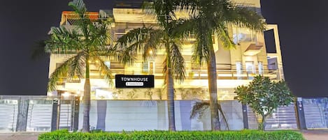 A modern building with a sign reading 'TOWNHOUSE.'