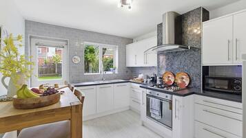 Coffee/tea maker, fridge, microwave, oven
