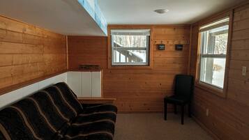 Basic Cabin, Balcony, Lake View | Living area