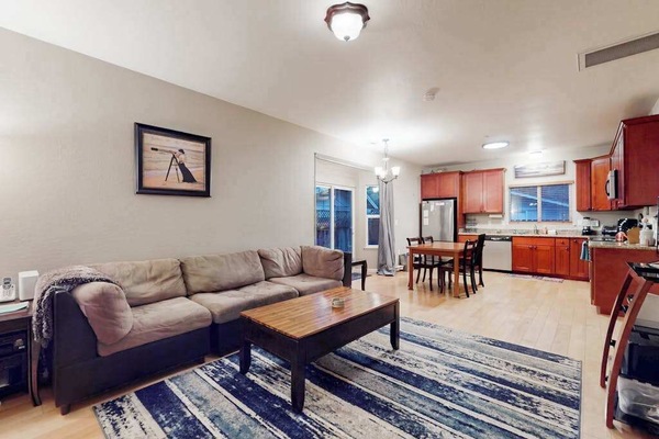 Settle into your open-concept living space with plush sectional seating and a fully equipped kitchen steps away — perfect for planning your Sonoma wine country adventures.