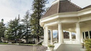 A covered outdoor area with a sign reading 'The Grill at Silverado.' - Napa 2BR Silverado condo — two king suites, fireplace & pool (Napa)