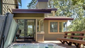 A hot tub in a backyard with a house in the background. - Wine Country Home w/ Solar-Heated Pool, Hot Tub & Mountain Views | Sleeps 8 (Santa Rosa)