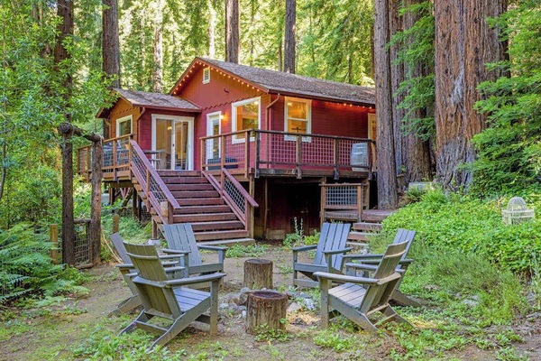 Step off your rear deck into a private redwood grove with Adirondack seating circled around a fire pit — your evening gathering spot under the canopy.
