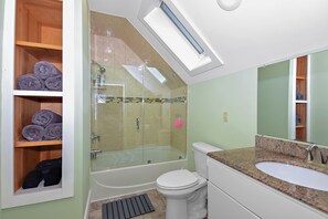 Shower, hair dryer, towels, toilet paper