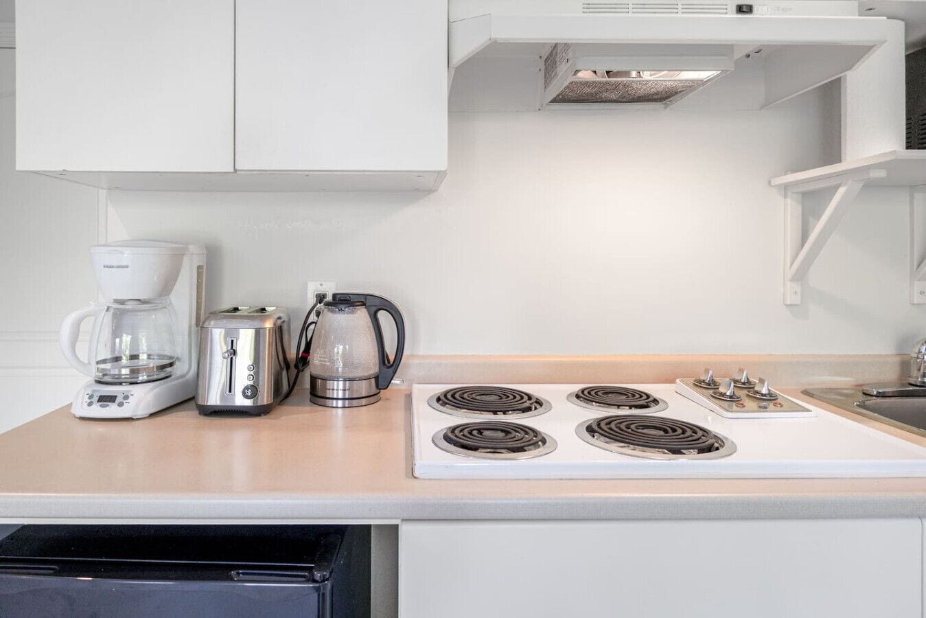 Fridge, microwave, stovetop, coffee/tea maker