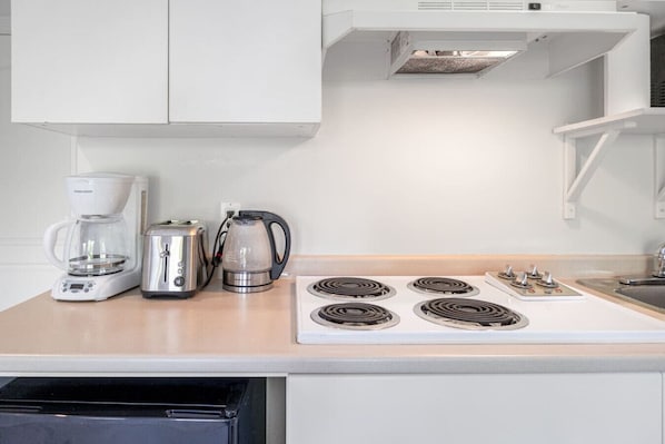 Fridge, microwave, stovetop, coffee/tea maker
