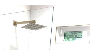 A glass-enclosed shower area with a handheld showerhead and a fixed showerhead on the wall. - Beautiful ADU with kitchen, washer and dryer. Near cafes, grocery stores and gym (Pasadena)