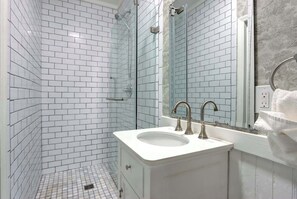 Shower, hair dryer, towels, shampoo - The Olmstead | 1800s Victorian Flat | Forsyth Park (Savannah)