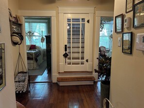 A wooden staircase leading to a room labeled 'Truelove Treehouse,' with a door marked 'Room Service.' - World Cup rental.  Dallas 3BR historic home 20 minutes to World Cup stadium. (Dallas)