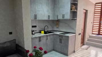 Signature Apartment, 2 Bedrooms | Private kitchen | Full-size fridge, microwave, stovetop, coffee/tea maker