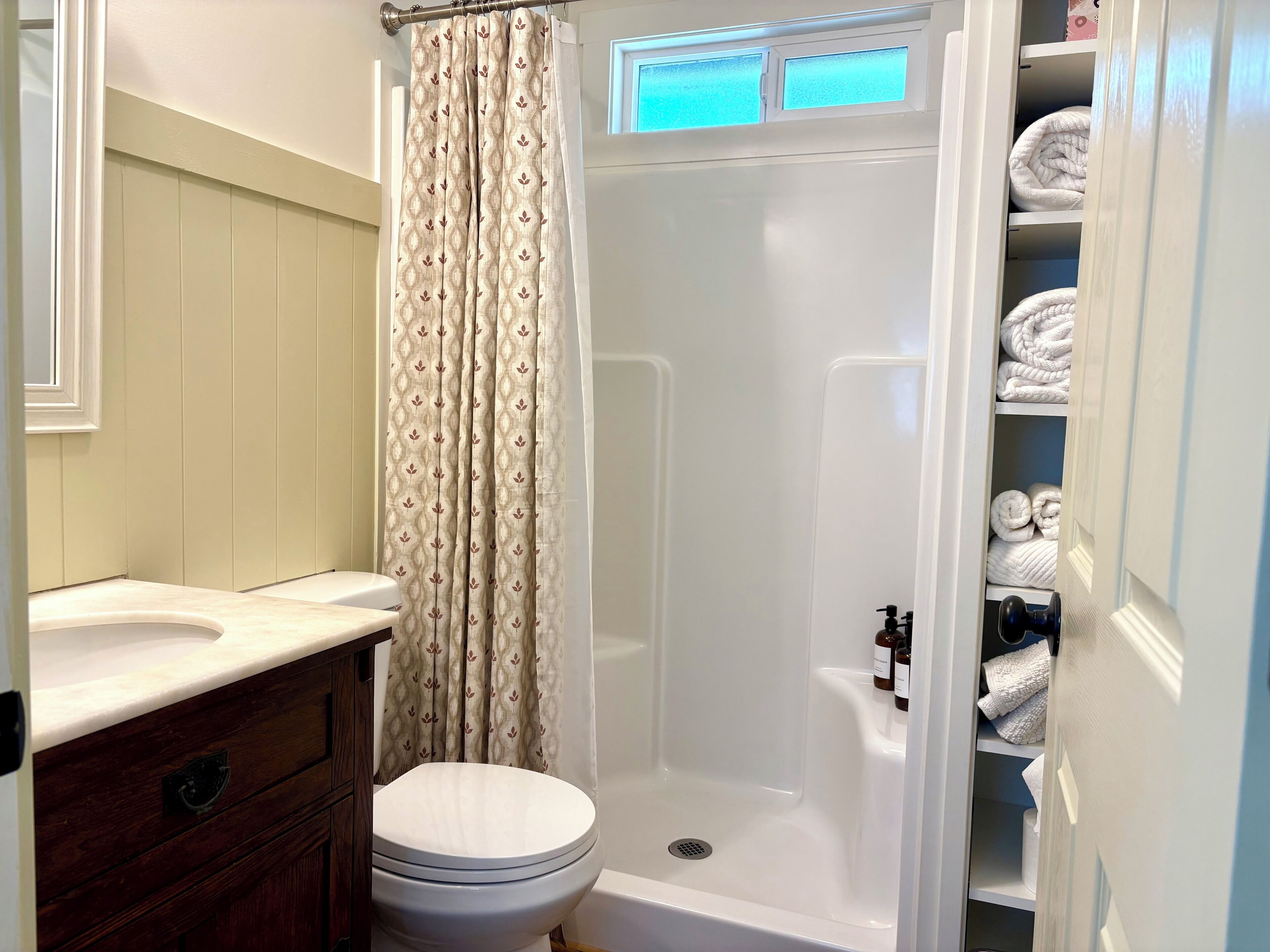 Shower, hair dryer, towels, soap