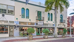 A building with a sign reading 'CABOS CANTINA' and outdoor seating. - Cozy Water Views Apt Fort Myers (Fort Myers)