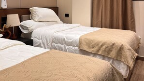 A hotel room with two beds, a nightstand, a lamp, and a large window with curtains. - Perfect studio with AC in charming 6 October city (6 October)
