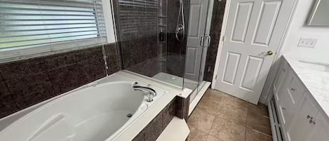 Shower, jetted tub, towels, soap