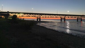 A bridge over a body of water with a clear sky. - Perfect Mackinaw City Location! One block to Downtown, Ferry, or Waterfront (Mackinaw City)