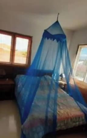 Habitación. WEAVING MILL ARUBA bed and coffee