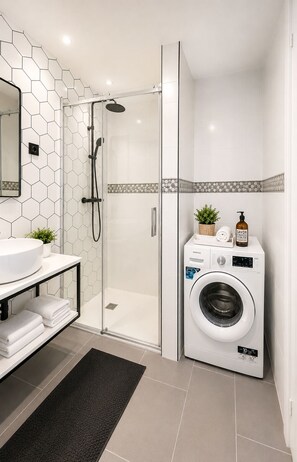 Shower, hair dryer, towels, soap