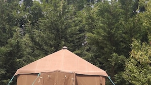 A brown tent-like structure in a grassy field with trees in the background. - La tente du Commandant PC 1954 - Unique nature experience including breakfast (Arrest)