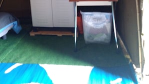 A tent with a kitchenette area including a microwave, a small table, and a storage cabinet. - La tente du Commandant PC 1954 - Unique nature experience including breakfast (Arrest)