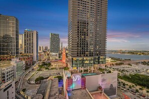 A high-rise building with a modern design, surrounded by other tall buildings and a waterfront. - Casa Marina – Skyline Views Luxury Downtown Tower (Miami)
