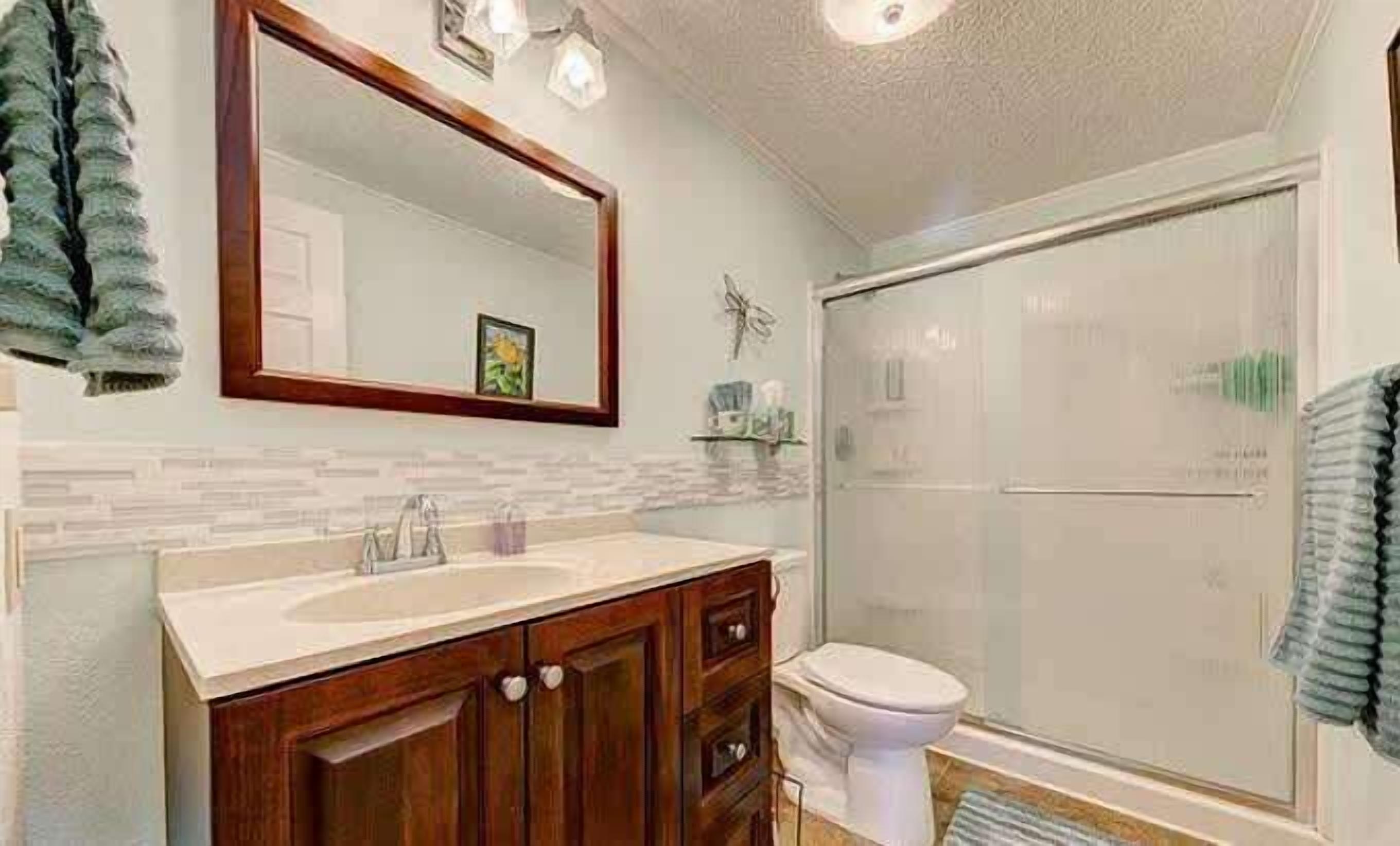 Shower, hair dryer, towels, shampoo