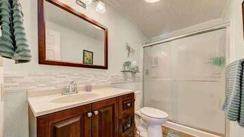 Shower, hair dryer, towels, shampoo