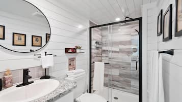 Shower, hair dryer, towels, shampoo
