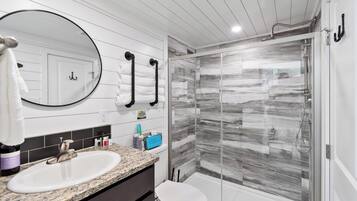 Shower, hair dryer, towels, shampoo