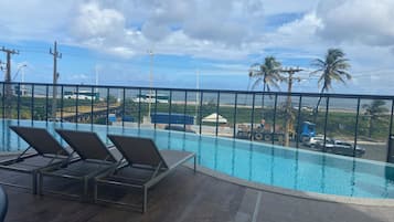 Comfort Apartment, Beach View | Pool | 4 outdoor pools, pool umbrellas, pool loungers