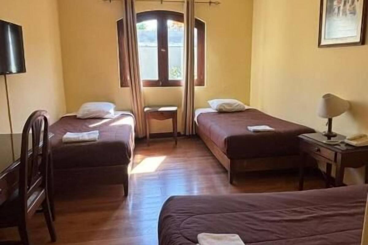 Triple Room, Patio, Courtyard View | In-room safe, iron/ironing board, free WiFi