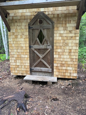 Exterior detail. This woods cabin is a true wilderness getaway. Get ready to commune with nature.