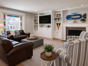 Smart TV, fireplace, books