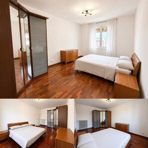 A bedroom with a bed, a dresser, a desk, and a wardrobe. - Stay in the historic center of Bologna (Bologna)