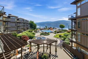 A modern hotel with outdoor pools, a gazebo, and a view of the lake. - Luxury Suite at Cove Resort with Full Amenities (West Kelowna)